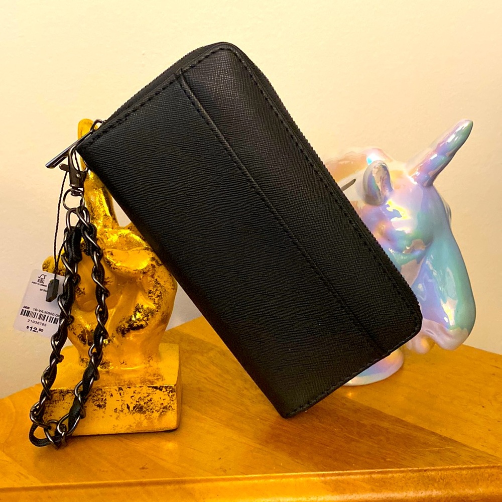 Black wallet/wristlet from Ardene. Measures 7.5in x 4in